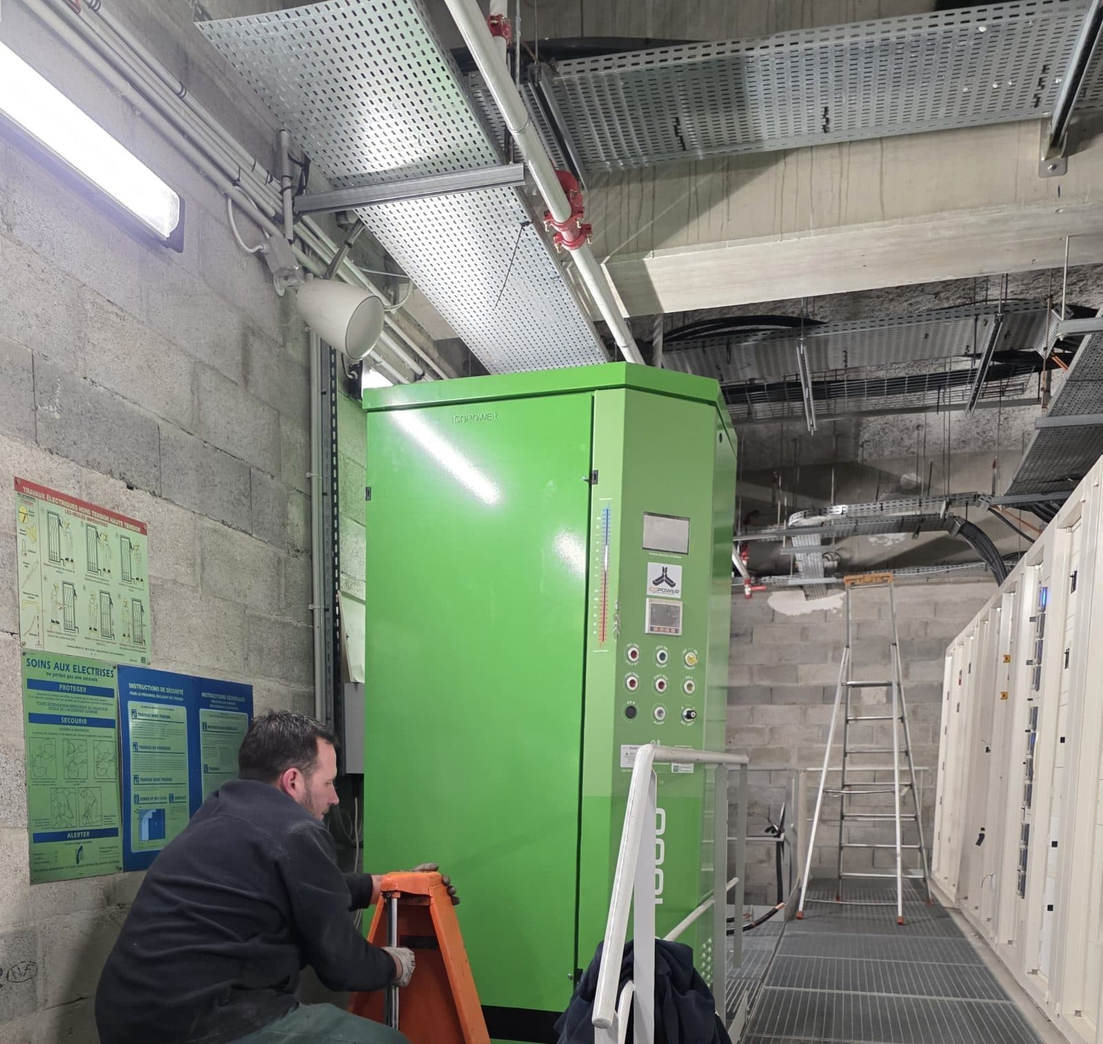 Technician working next to an Icopower F1000 in a basement plant room